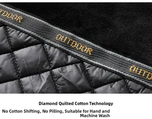 Détail de la doublure de veste avec velours noir et tissu matelassé à losanges gris