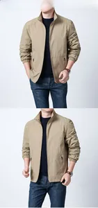 Detail view of khaki men's stand-collar jacket featuring full-zip closure and elastic cuffs