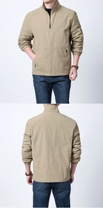Detail of khaki men's stand collar jacket featuring elastic cuffs and zipper pockets