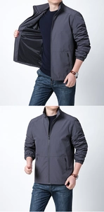 Detail view of men's lightweight windbreaker with zipper and mesh lining in dark grey