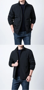 Detail of a men's black stand collar jacket with zipper pocket and elastic cuffs