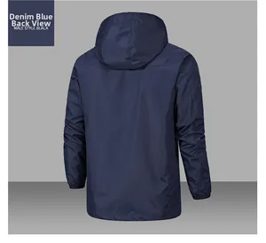 Rear view of a denim blue men's hooded outdoor jacket with windproof fabric details