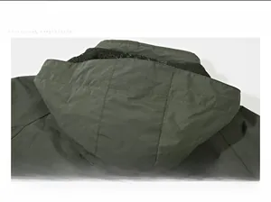 Detail view of the breathable black mesh lining inside the olive green windbreaker hood