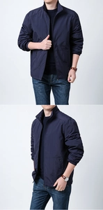 Detail of dark blue lightweight jacket showing stand-up collar and elastic cuffs