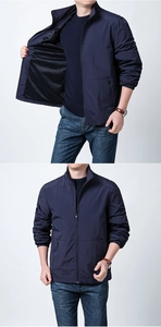 Detail of navy blue men's jacket showing standing collar and breathable mesh lining