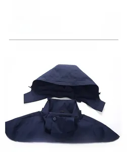 Detail view of the detachable wide-brim hood on a dark blue windproof hiking jacket