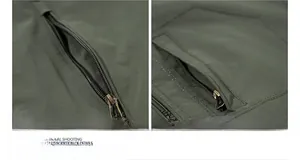 Detailed macro view of zipper pocket on dark green outdoor jacket with neon pulls