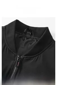 Detail of ribbed knit collar and matte polyester fabric on men's black casual jacket