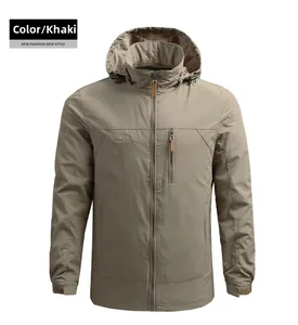 Detail of khaki outdoor hooded jacket featuring chest pocket and mountain logo print