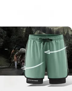 Detail of light green 2-in-1 sports shorts showing hidden phone pocket on inner black layer