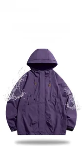 Detailed view of the purple waterproof windbreaker fabric with water droplets splashing