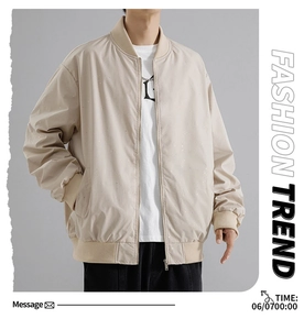 Detail of beige men's bomber jacket with ribbed collar and high-quality zipper closure