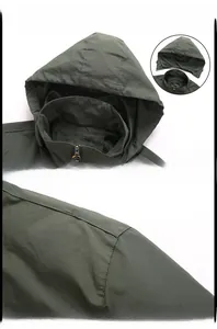 Detail of dark olive outdoor jacket featuring a detachable hood and mesh lining