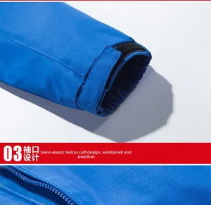 Detail view of royal blue outdoor jacket with windproof adjustable velcro cuffs and zipper