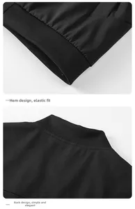 Detail view of the black jacket featuring a ribbed elastic hem and minimalist back seam