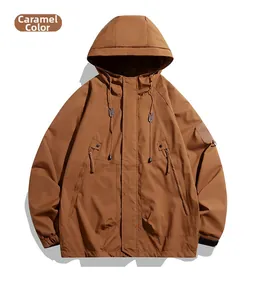 Detail of caramel hooded outdoor jacket with adjustable drawstrings and utility pockets