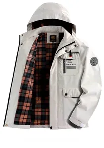 Detailed close-up of a men's off-white outdoor hooded jacket with black and brown plaid lining