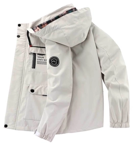 Detail of outdoor parka showing hood with classic plaid lining and chest zipper pocket