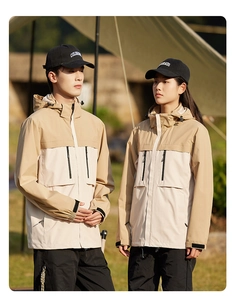 Detail of windproof hiking jacket with detachable hood and khaki color-block design