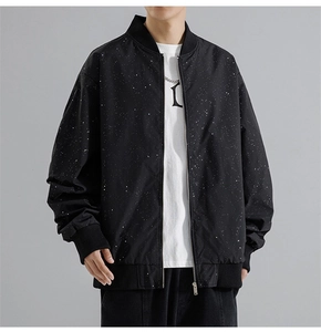 Detail of men's bomber jacket with starburst ink pattern and ribbed cuffs and collar
