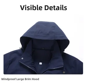 Detailed macro view of windproof hood design and metal zipper on blue hiking jacket