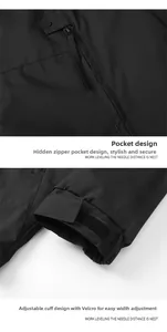Detail of hidden zipper pocket and adjustable velcro cuff on black outdoor jacket