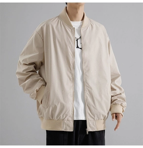 Detailed view of the ribbed cuffs and textured windproof fabric on this men's bomber jacket