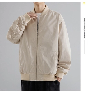 Detail of men's apricot bomber jacket showing ribbed baseball collar and shimmer fabric