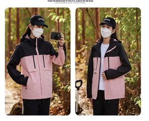 Detail of pink and black women's windproof jacket with multi-pockets and detachable hood