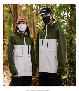 Detail of color-block windproof hooded jacket with multiple pockets for outdoor hiking