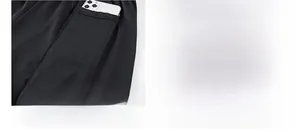 Detail of 2-in-1 sports shorts showing inner phone pocket and wash label for comfort