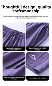Detail view of purple athletic shorts showing elastic waistband and mountain embroidery