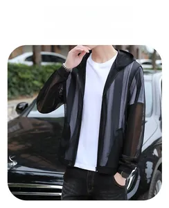Detail of breathable black mesh sun protection jacket with hood on outdoor male model