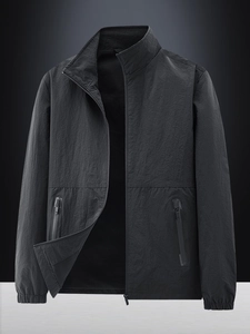 Men's dark gray lightweight windbreaker jacket with stand collar and waterproof pockets