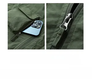 Detail of multi-pocket design on army green outdoor vest with durable metal zipper