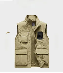 Close-up of khaki outdoor vest showing breathable mesh lining and multiple functional pockets