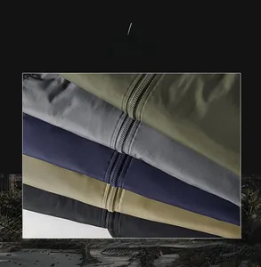 Detailed macro view showing metal zipper and ribbed cuffs on the flight jacket