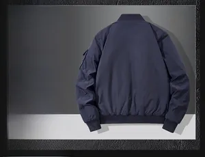Detail view of navy blue bomber jacket showing insulated lining with ribbed collar and cuffs