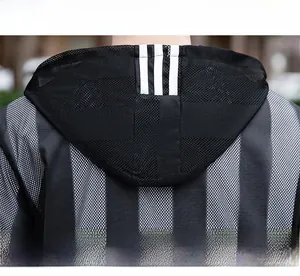 Detailed close-up of the breathable honeycomb mesh fabric and striped hood on this jacket