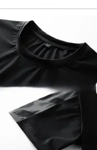 Detail view showing stitching and L-size label on black quick-dry sports t-shirt