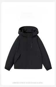 Detail of waterproof fabric and adjustable cuffs on this black hooded outdoor jacket