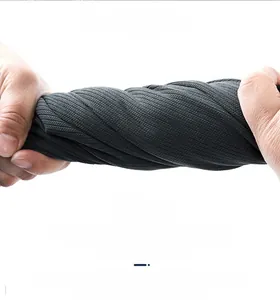 Macro shot showing high elasticity and wrinkle resistance of the dark grey ribbed fabric
