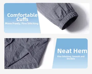 Detail view of elastic cuffs and flat hem on a lightweight gray sun protection jacket
