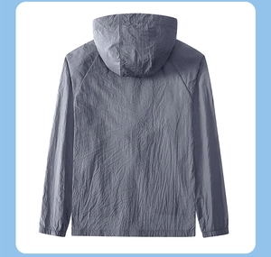 Macro view of blue-grey ice silk sun protection jacket with hood and raglan sleeves