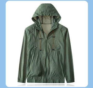 Detail of dark green UV protection jacket with drawstring hood and cargo pockets