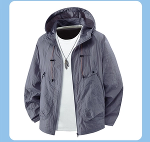 Detailed close-up of hooded sun protection jacket with adjustable drawstring and cuffs