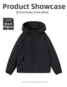 Detail of black waterproof outdoor jacket showing zipper pockets and windproof fabric
