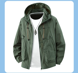 Detail of dark green hooded sun protection jacket with zip pockets and elastic cuffs
