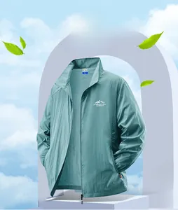 Detail view of mint green sun protection jacket featuring zip-up collar and outdoor logo