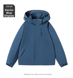 Detail of denim blue waterproof jacket with velcro cuffs and functional zip pockets